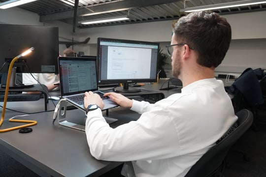 Member of the elcap team working at a computer